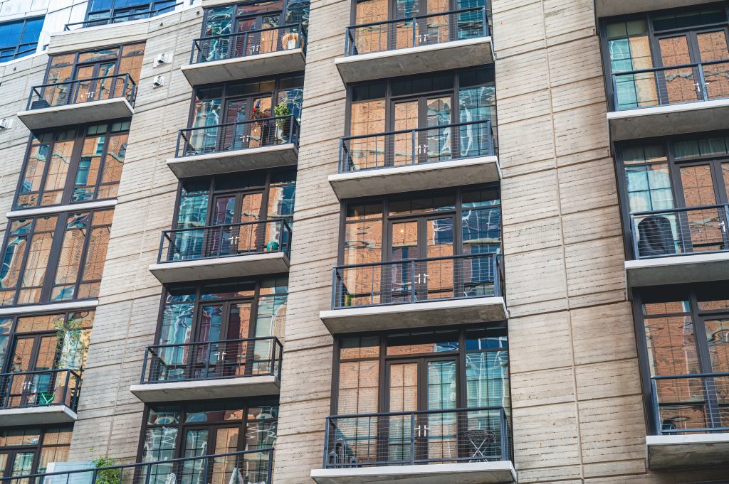 Modern apartment building exterior representing premises where a fire risk assessment must be reviewed regularly to remain valid and compliant.