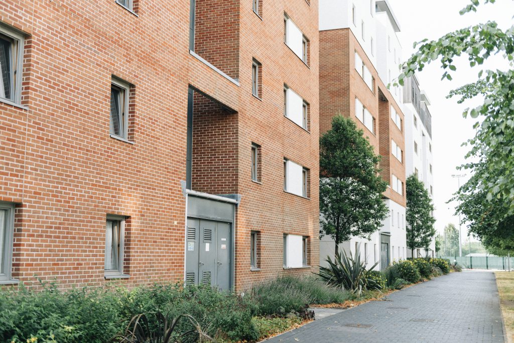Modern residential apartment buildings representing premises where the 5 steps of a fire risk assessment are carried out to identify hazards and ensure compliance.