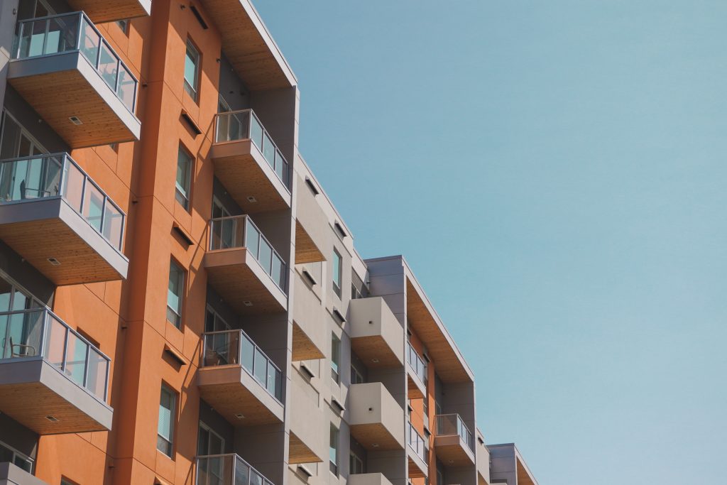 Modern apartment building illustrating residential settings where a Person-Centred Fire Risk Assessment (PCFRA) and a Personal Emergency Evacuation Plan (PEEP) support occupants with additional evacuation needs.